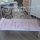 Wrought iron baby bed. Or bench seat of your choice
