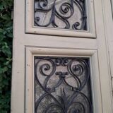 Porte d'entrée cintrée double en chêne, grilles et verre, XIXème