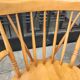 Four chairs and a Heywood Wakefield Windsor armchair. Vintage