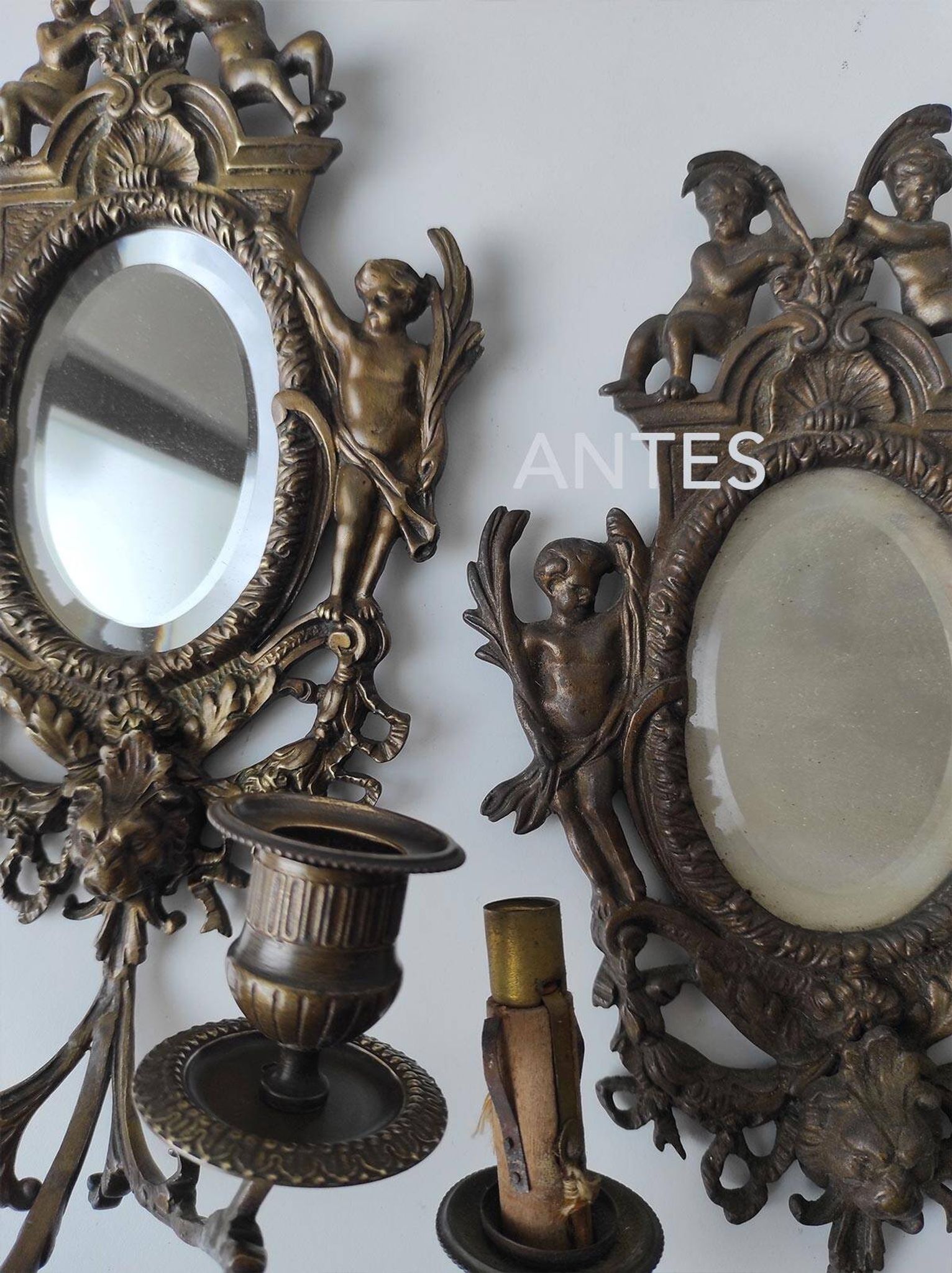 Pair of old French wall lights with beveled mirror and putti