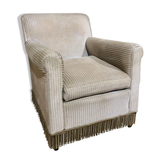 Velvet armchair with fringes