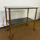 Console / desserte en laiton et verre fumé