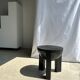 Black mango wood tripod side table with a semi-spherical top, height: 45 cm, diameter: 44 cm.