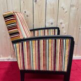 Art Deco armchair in multicolored striped fabric and its footrest