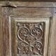 India. Bonnetière with a teak door finely carved by hand.