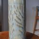 Signed chiseled and glazed stoneware roller/tube vase