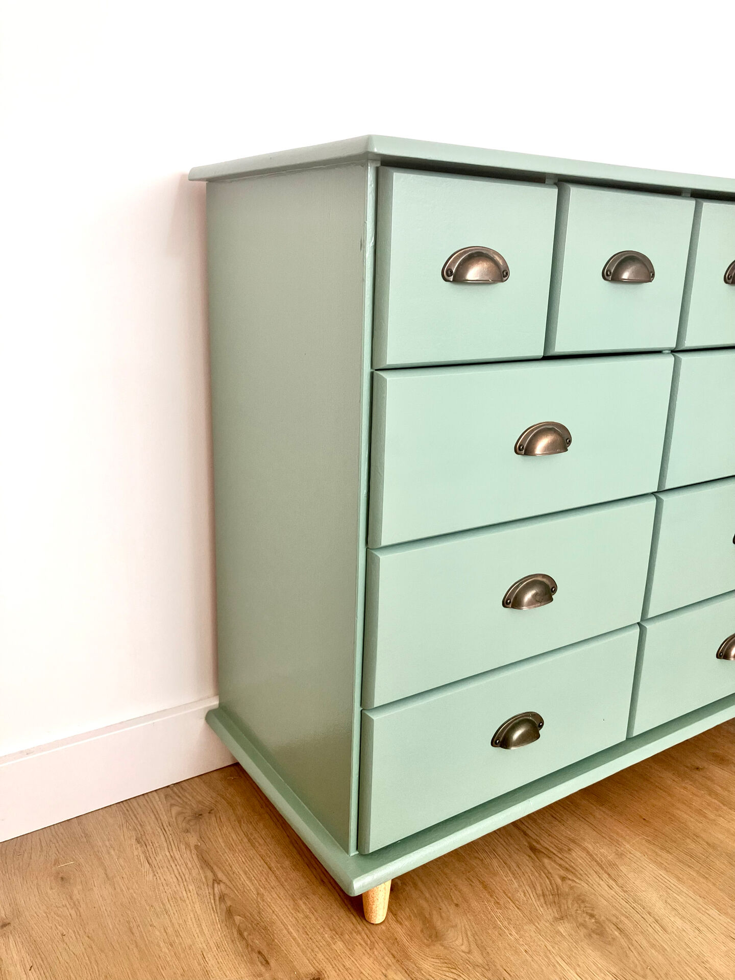 Low buffet with patinated gold handles.