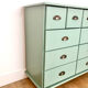 Low buffet with patinated gold handles.