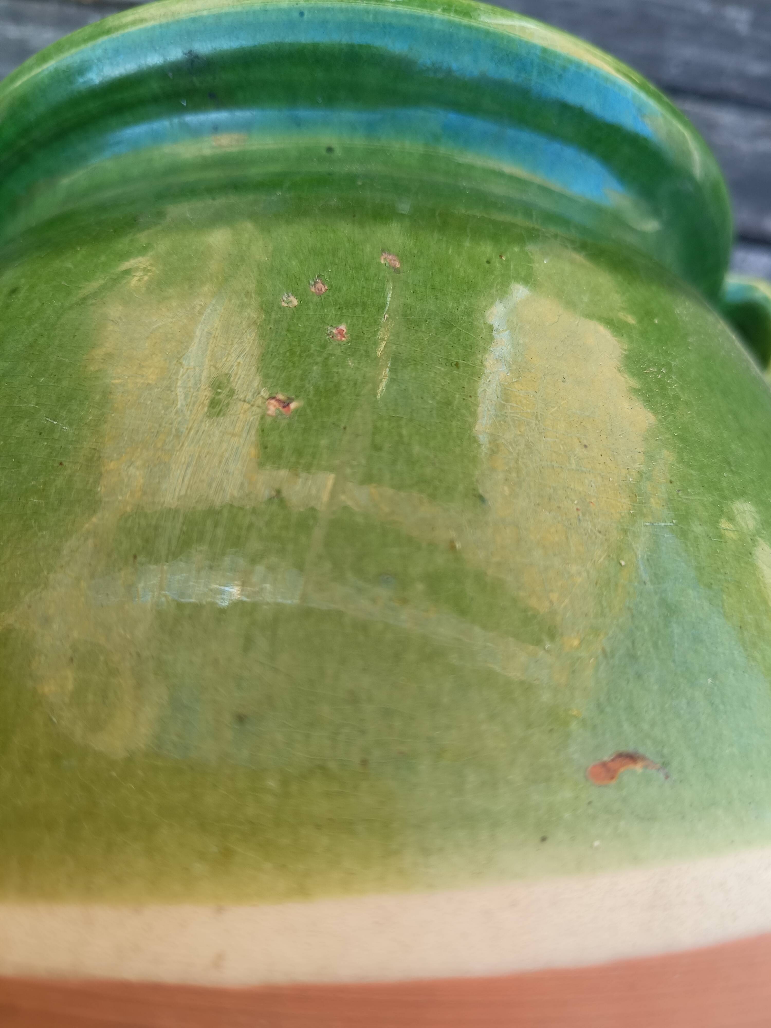 Mediterranean pot in green half-glazed terracotta.