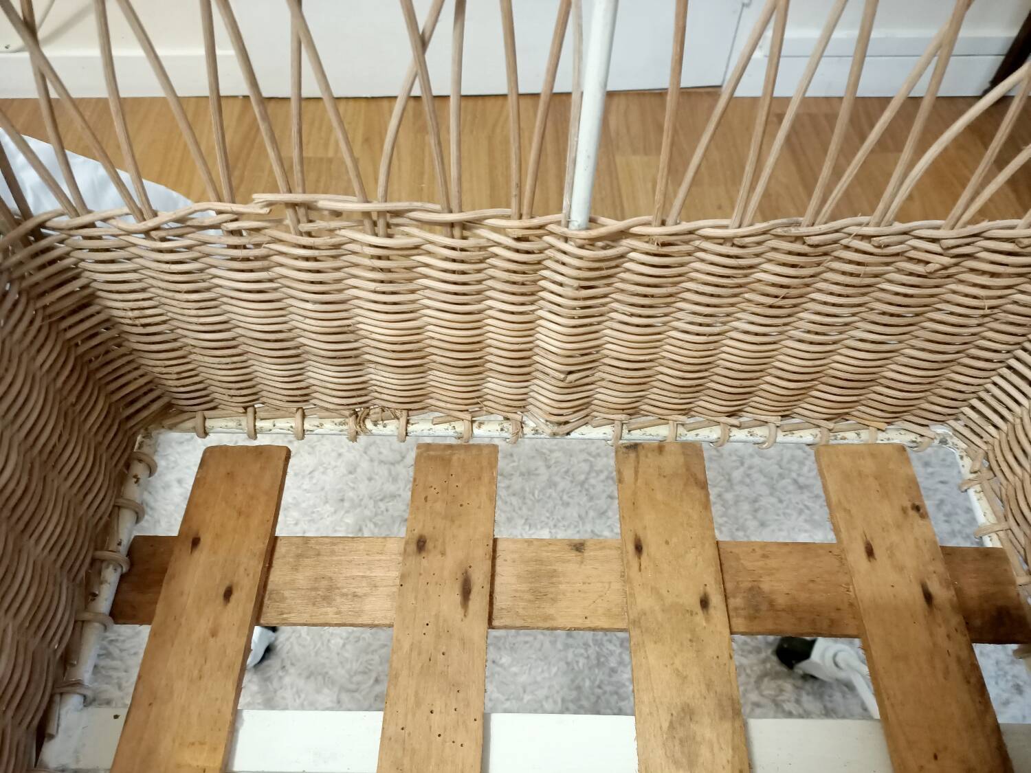 Rattan and wrought iron cradle