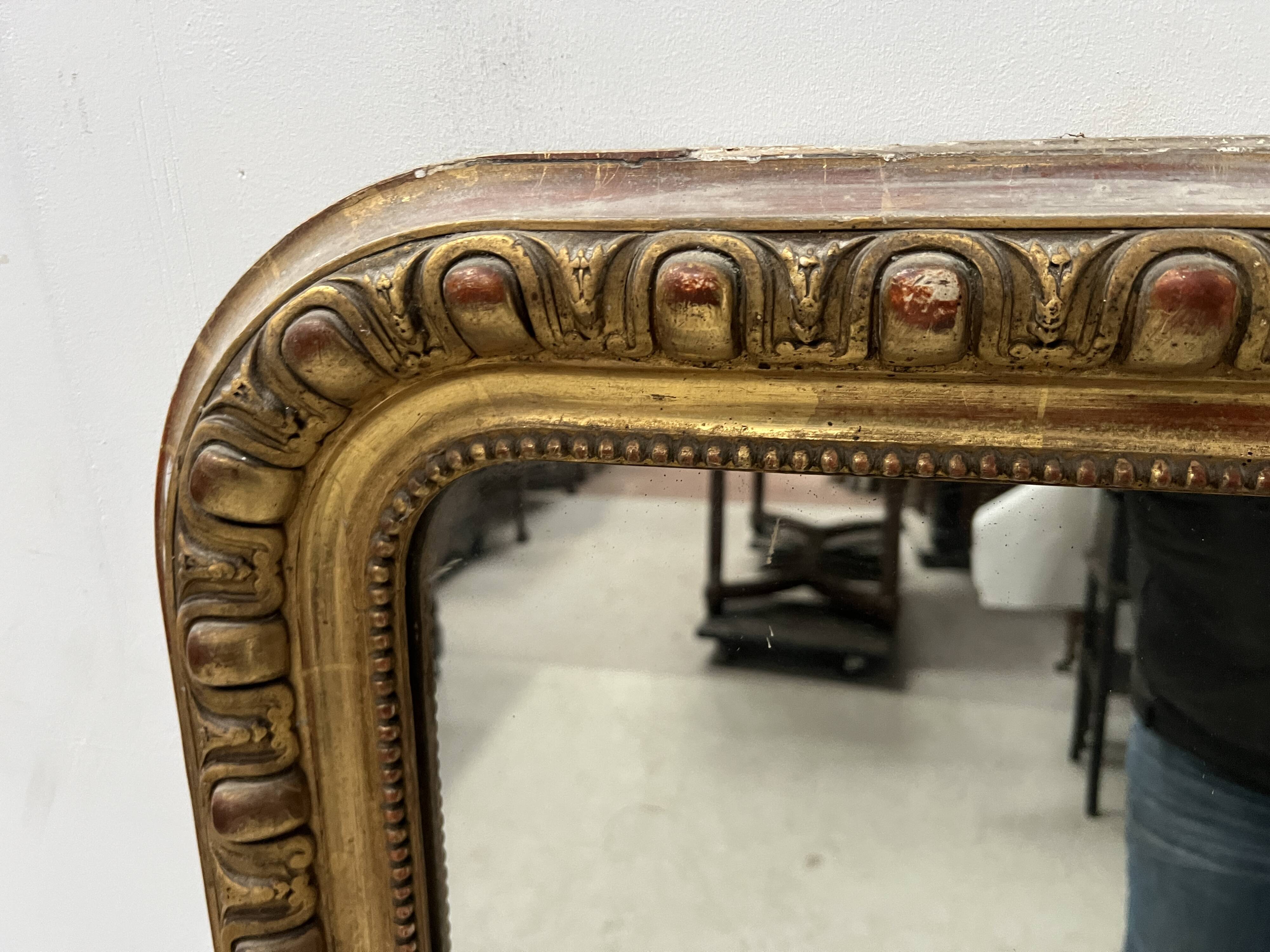 Louis Philippe gadrooned mirror in wood and gilt stucco, 19th century