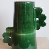 Handmade ceramic abstract vase with asymmetrical handles and fir green flowers