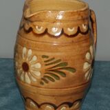 Glazed terracotta pitcher decorated with friezes and flowers