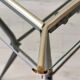 Antique side table in metal and glass