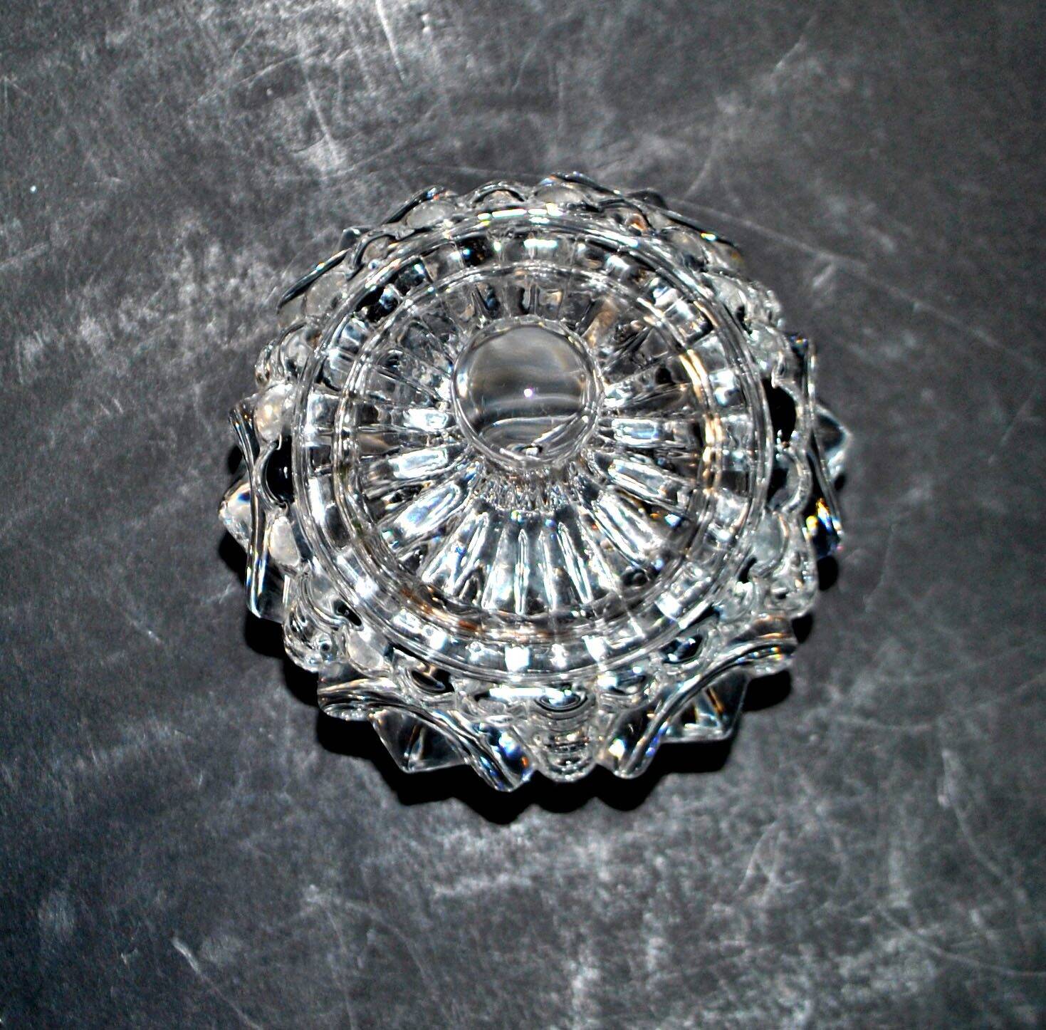 Thick moulded crystal sugar bowl with a beaded and medallion design.