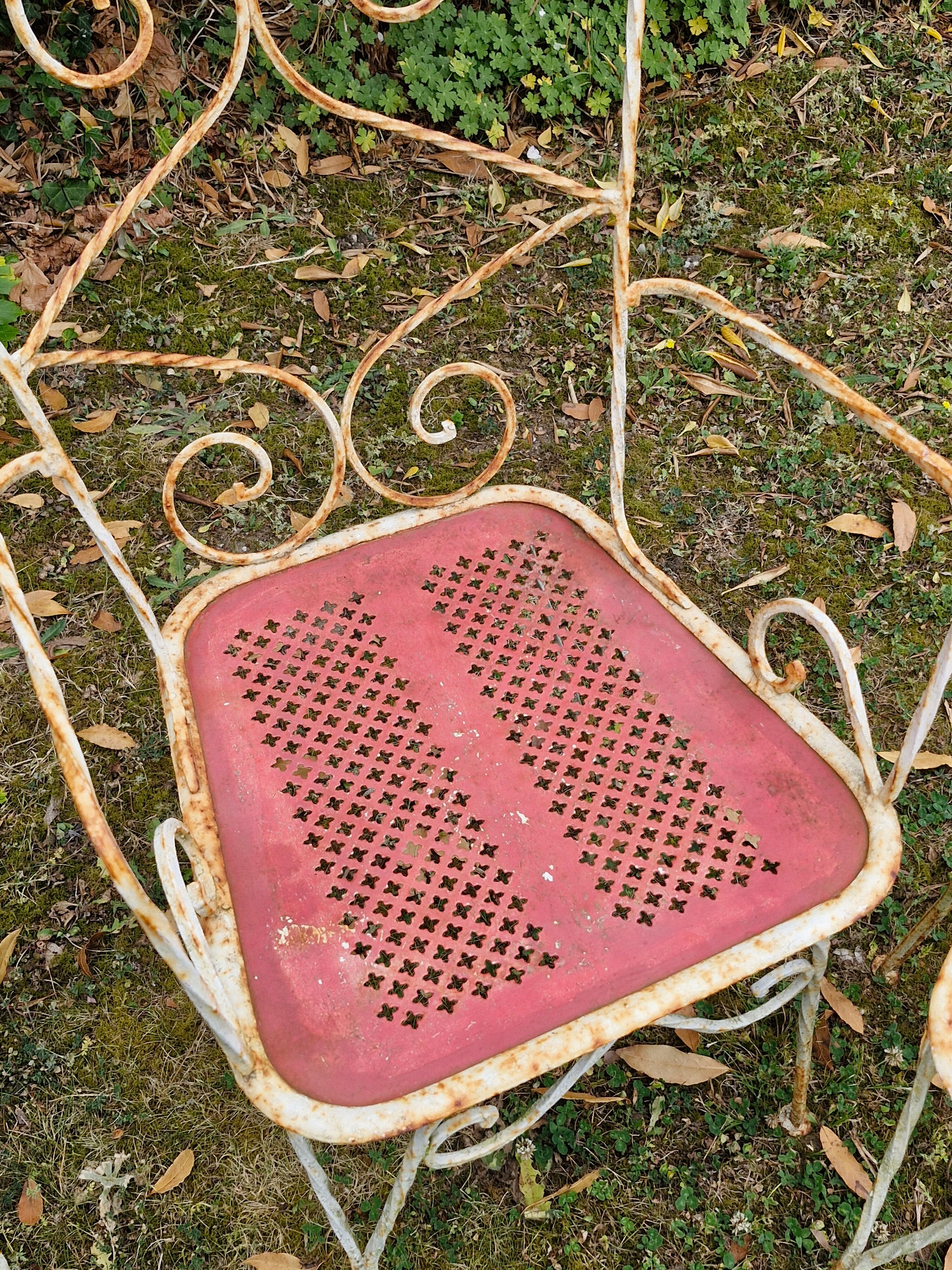 Perforated metal garden chairs and armchairs