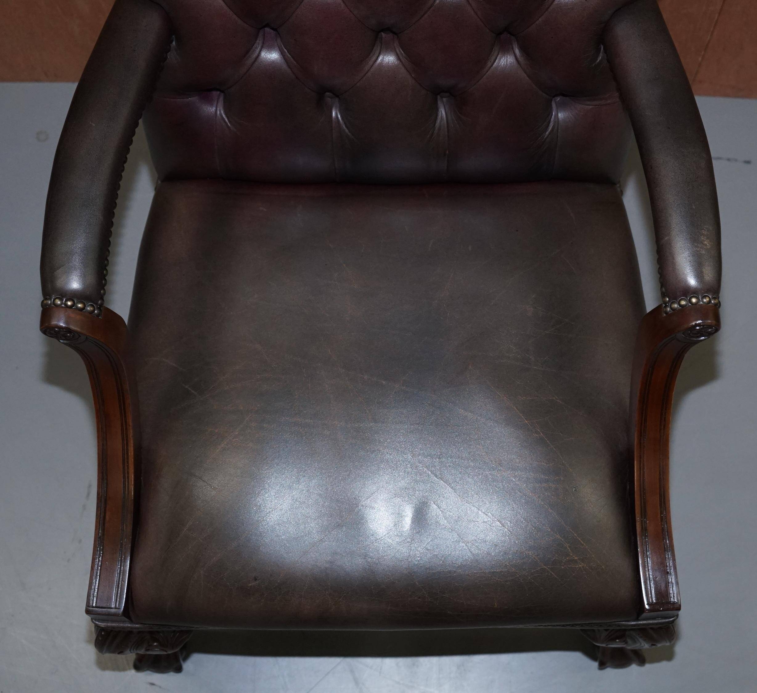 Gainsborough armchair George II leather Chesterfield hand-carved with claw and ball feet.