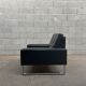 Pair of black leather armchairs