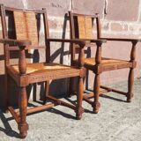 Pair of oak armchairs with straw seats and backs.