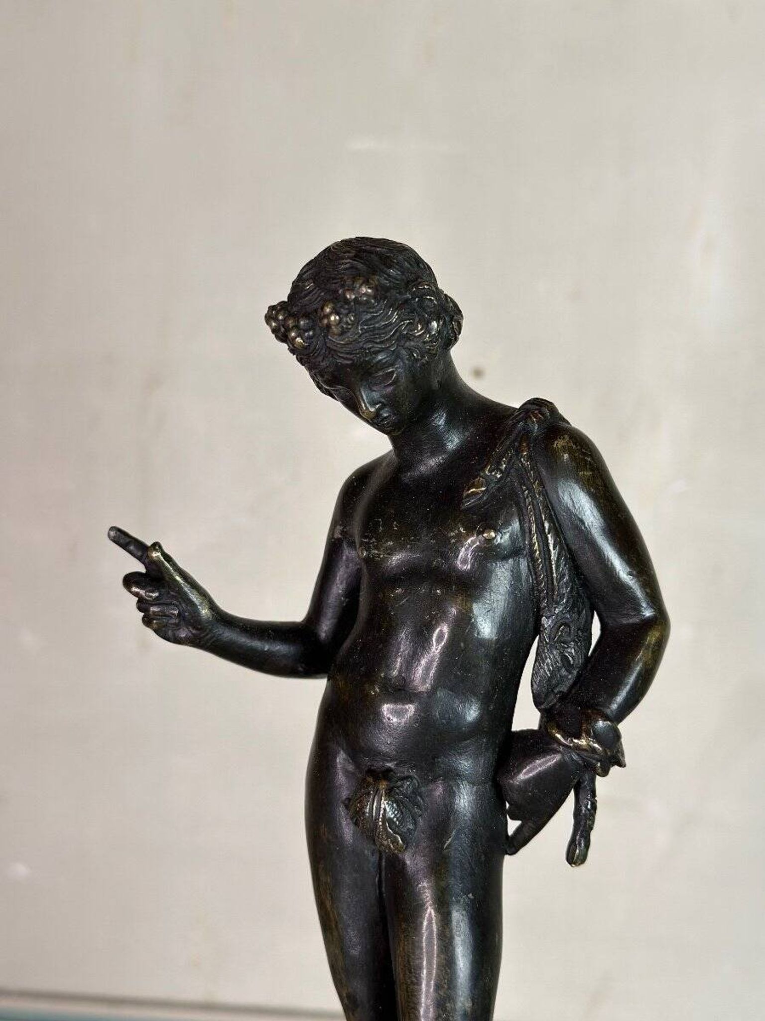 Narcissus, bronze after the antique on a wooden base, circa 1880.