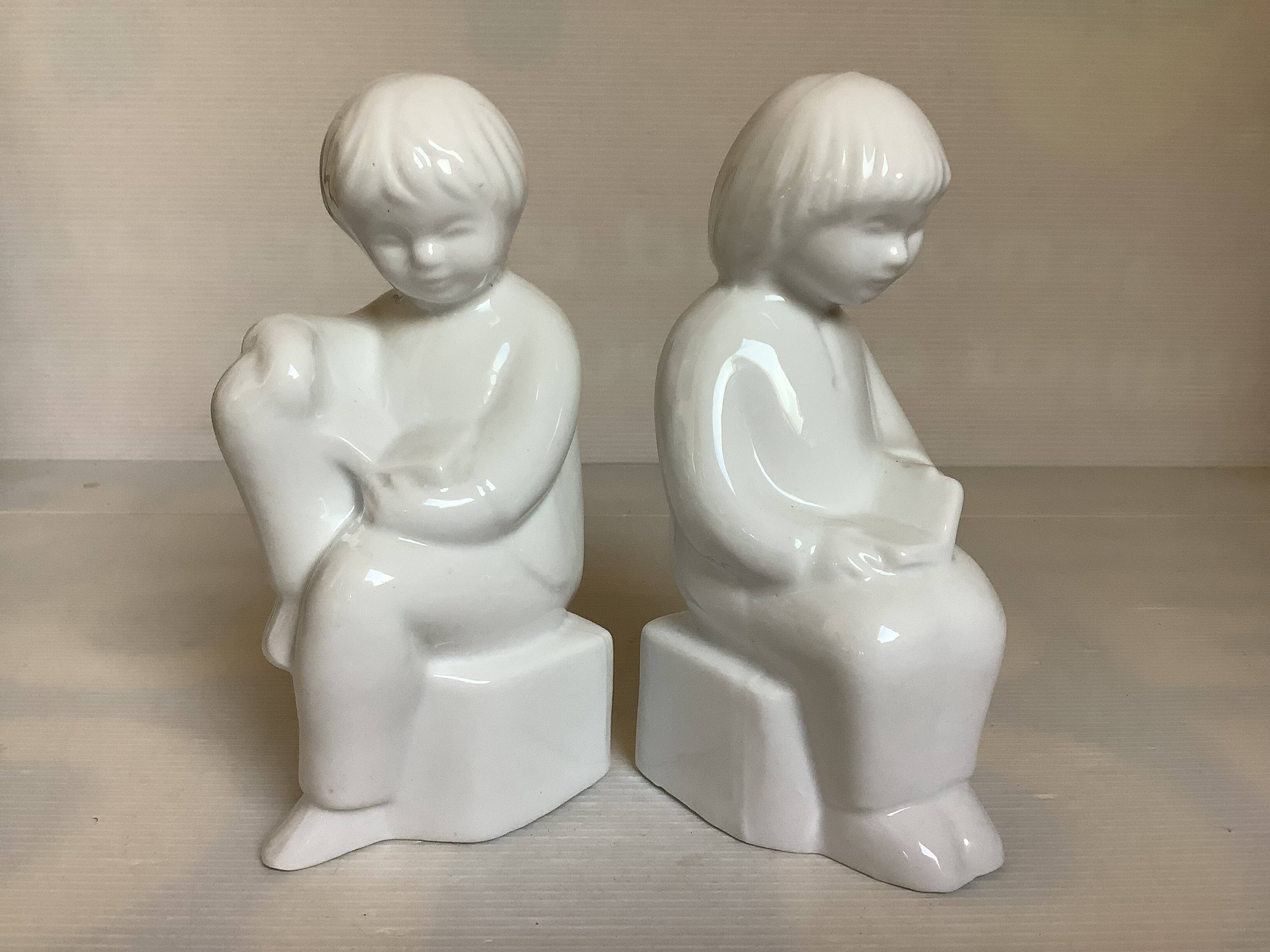 Pair of bookends featuring children reading from the 1970s.