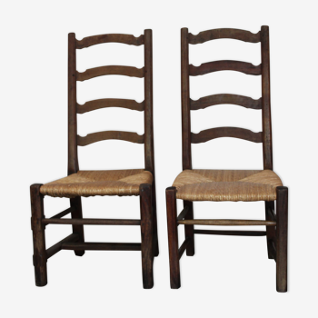 Pair of ancient mulched chairs