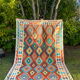 Oriental kilim rug afghan colored red and multicolored