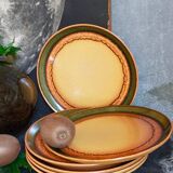 Six vintage stoneware plates with green net