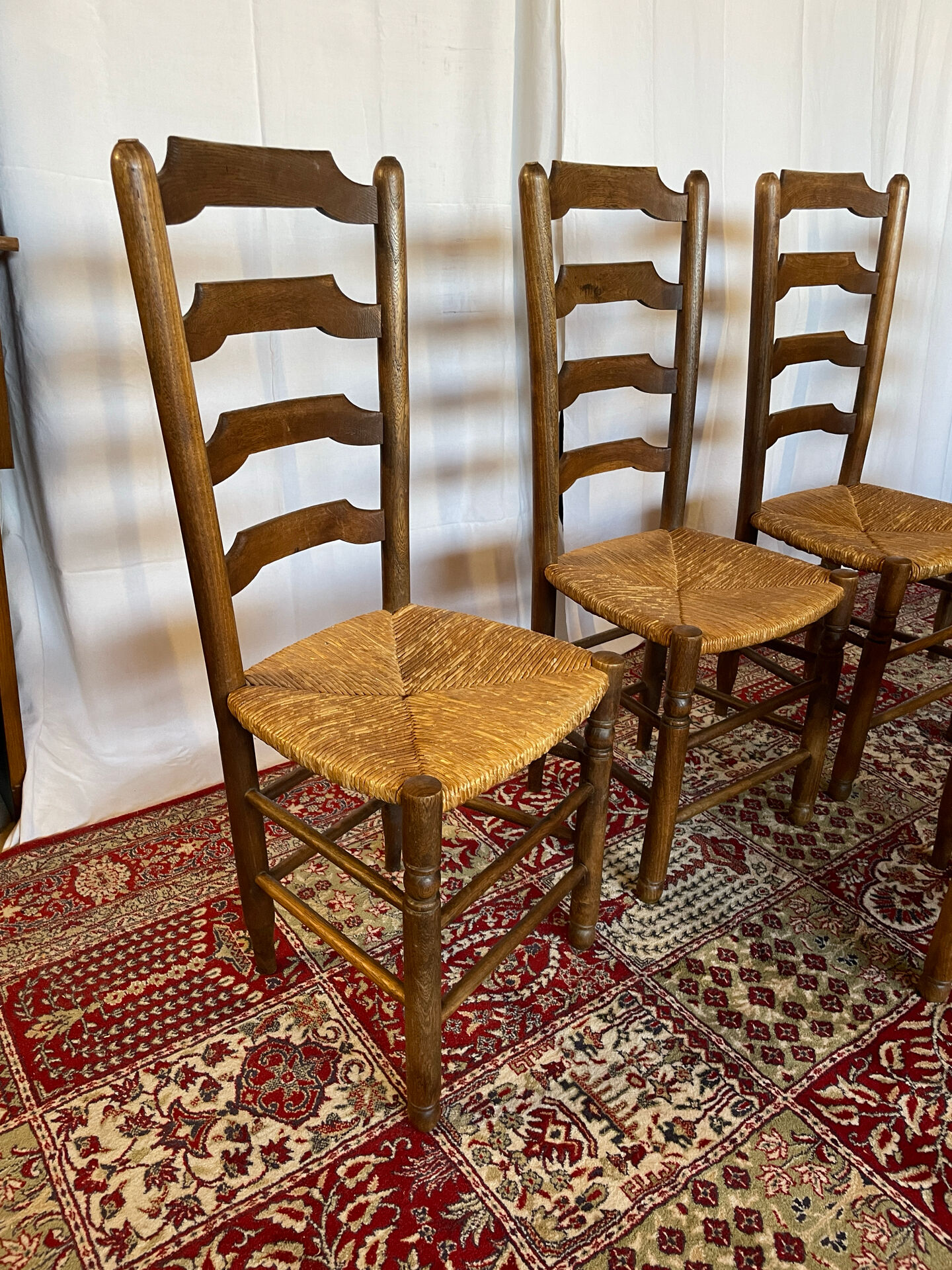 Set of 5 antique oak and straw chairs.
