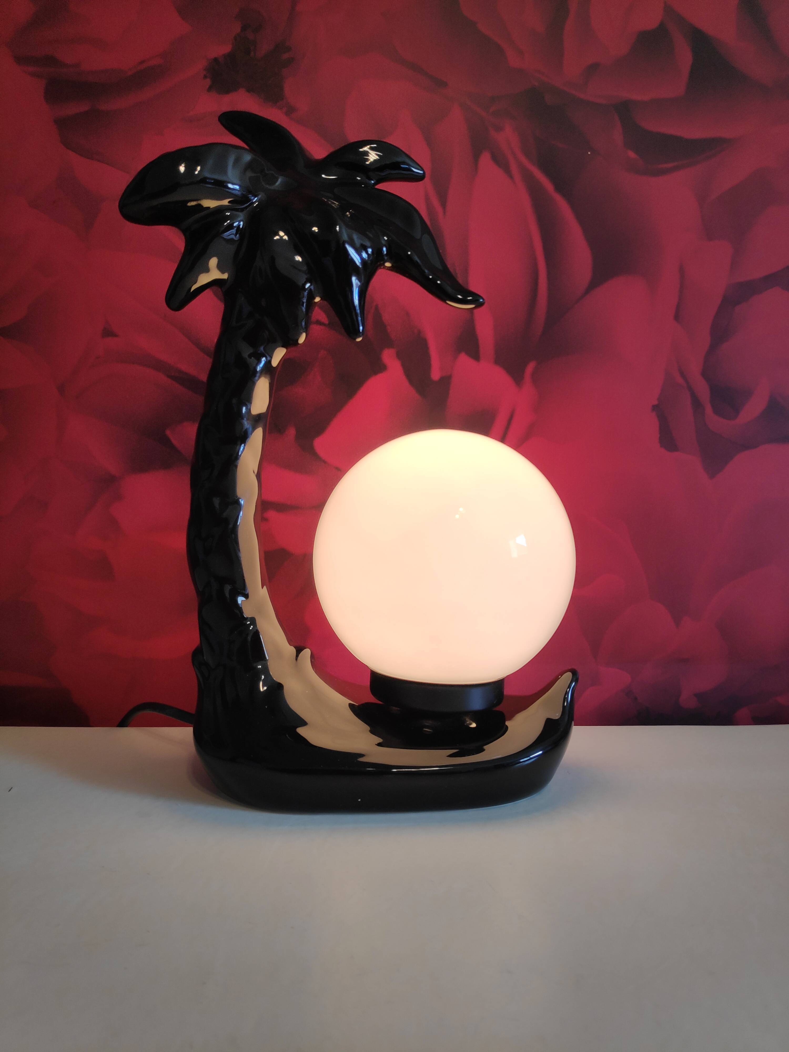 Black ceramic palm lamp and white opaline globe