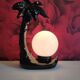 Black ceramic palm lamp and white opaline globe