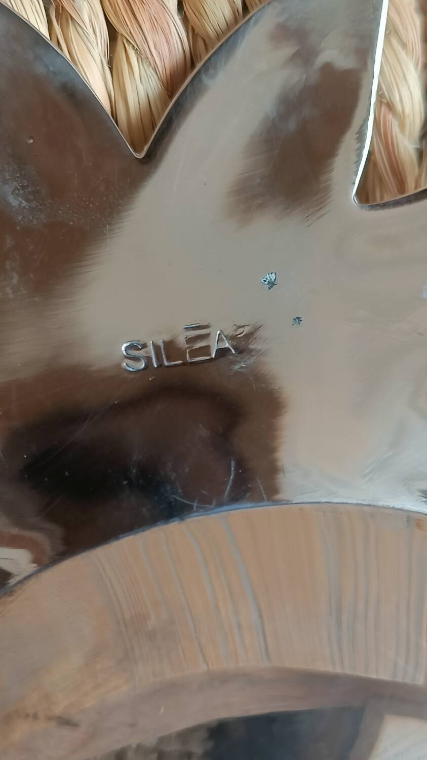 Silver-plated metal tray in the shape of a pineapple.