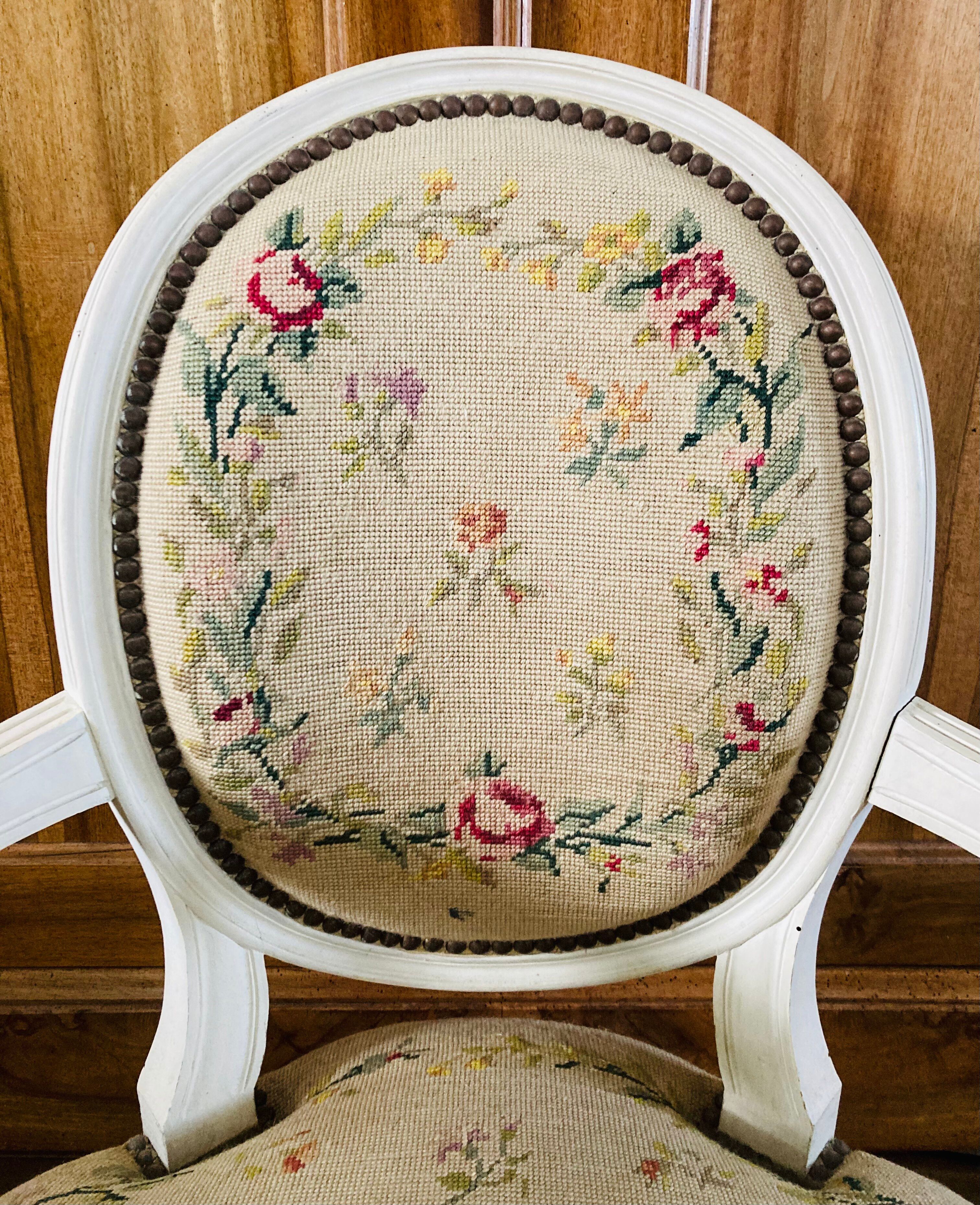 Upholstered armchair with cross-stitch in the Louis XVI style, 19th century.