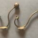 Pair of brass coat hooks