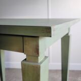 Green side table with tapered legs