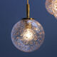 Four gold fleck globe pendants by Doria Germany
