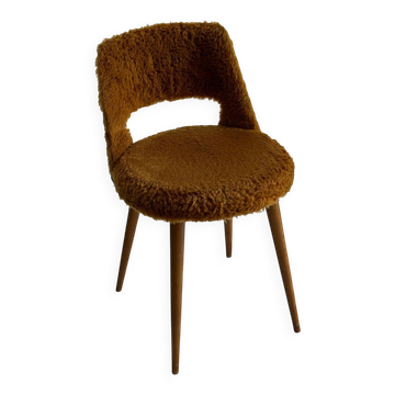 Camel barrel chair with faux fur by Baumann