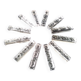 Box of 12 rectangular crystal knife rests.