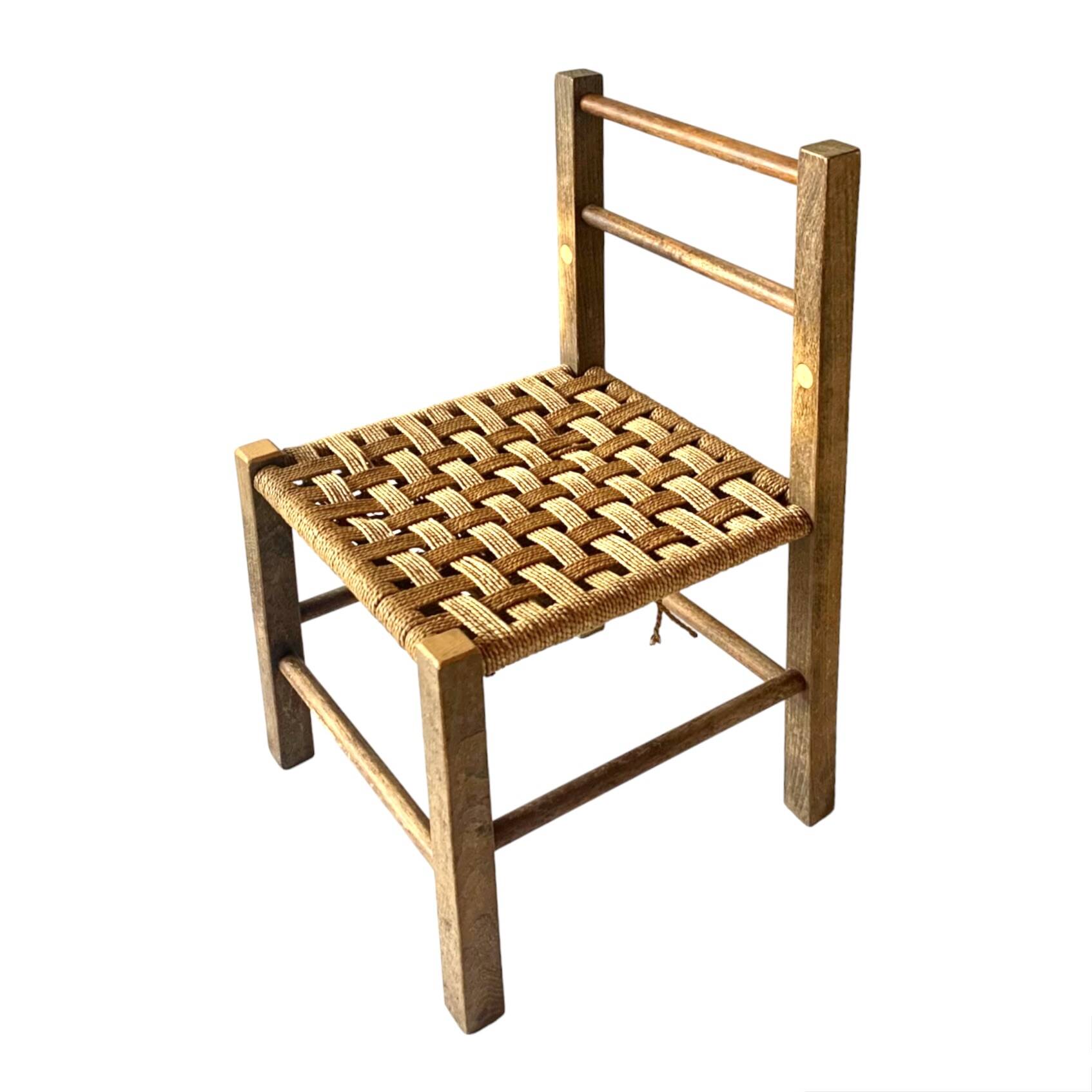 Vintage children's chair made of rope and wood