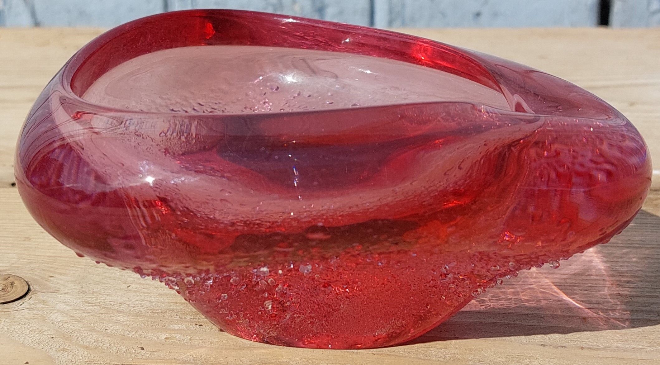Empty pink blown glass pocket