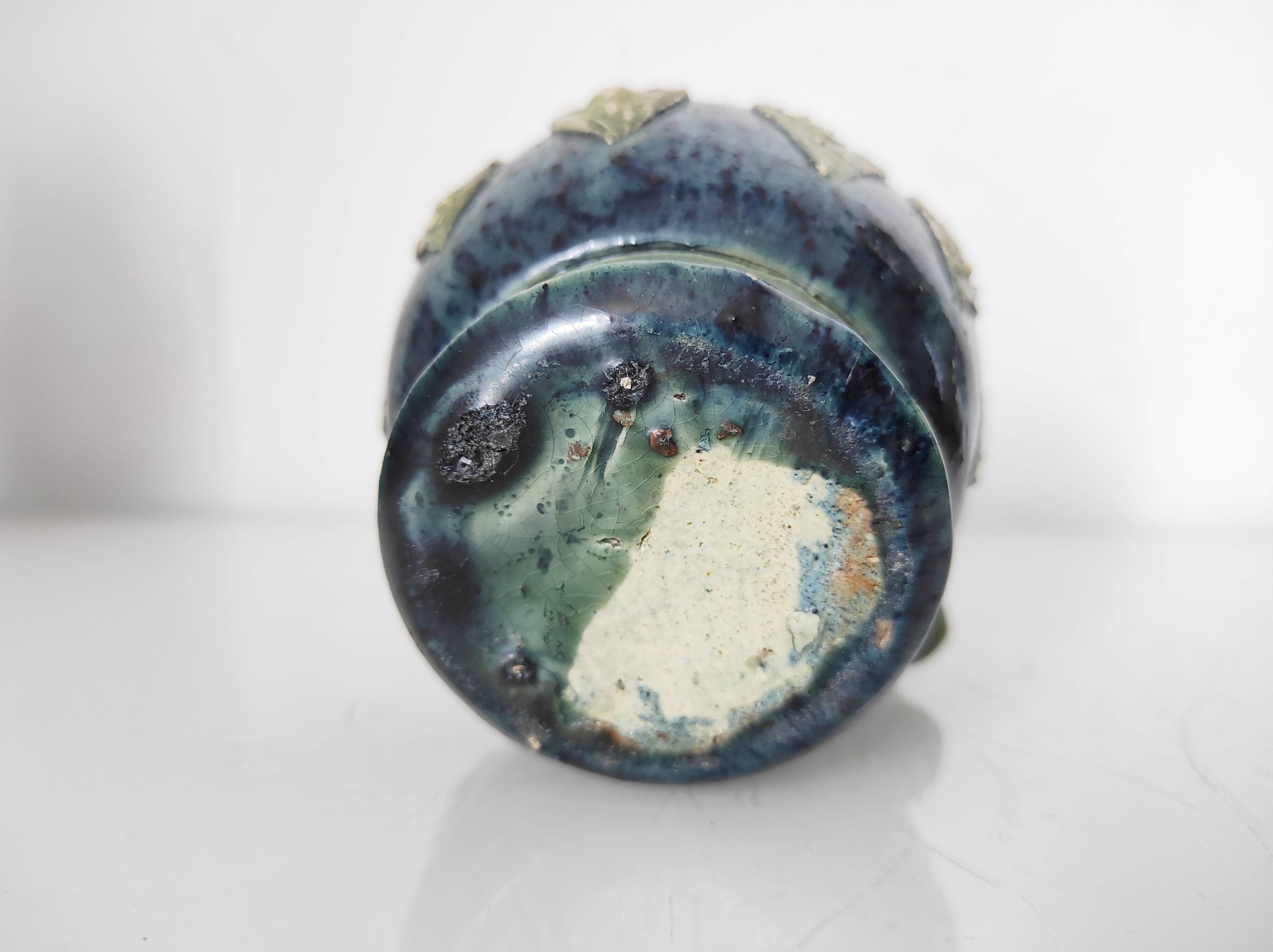 Two small blue ceramic vases
