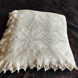 White cotton bedspread, crocheted sofa throw with star patterns