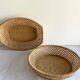 Pair of vintage braided rattan baskets