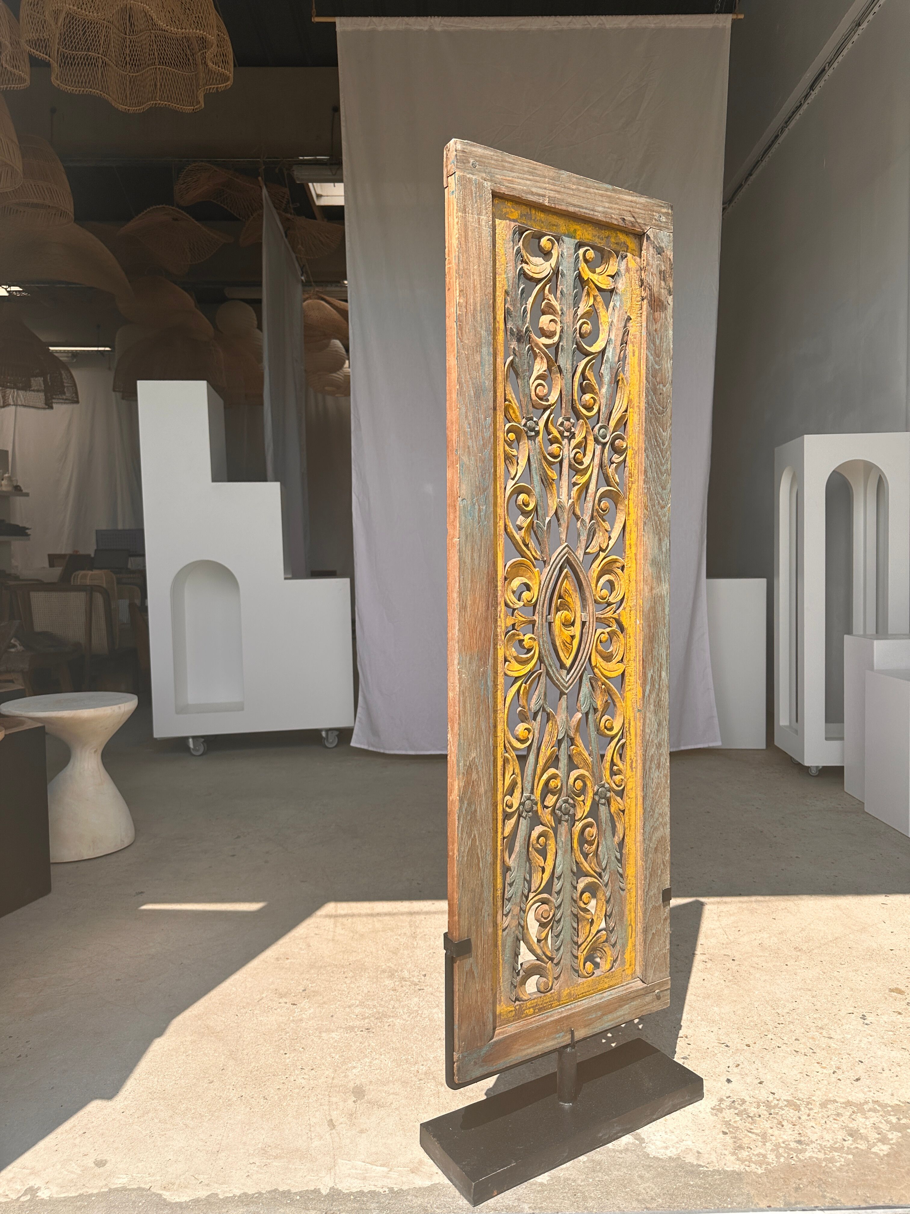 Rectangular Indonesian construction element with blue and yellow plant in carved wood