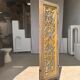 Rectangular Indonesian construction element with blue and yellow plant in carved wood