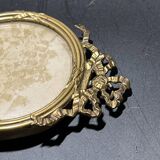 Old photograph of soldiers in a brass frame