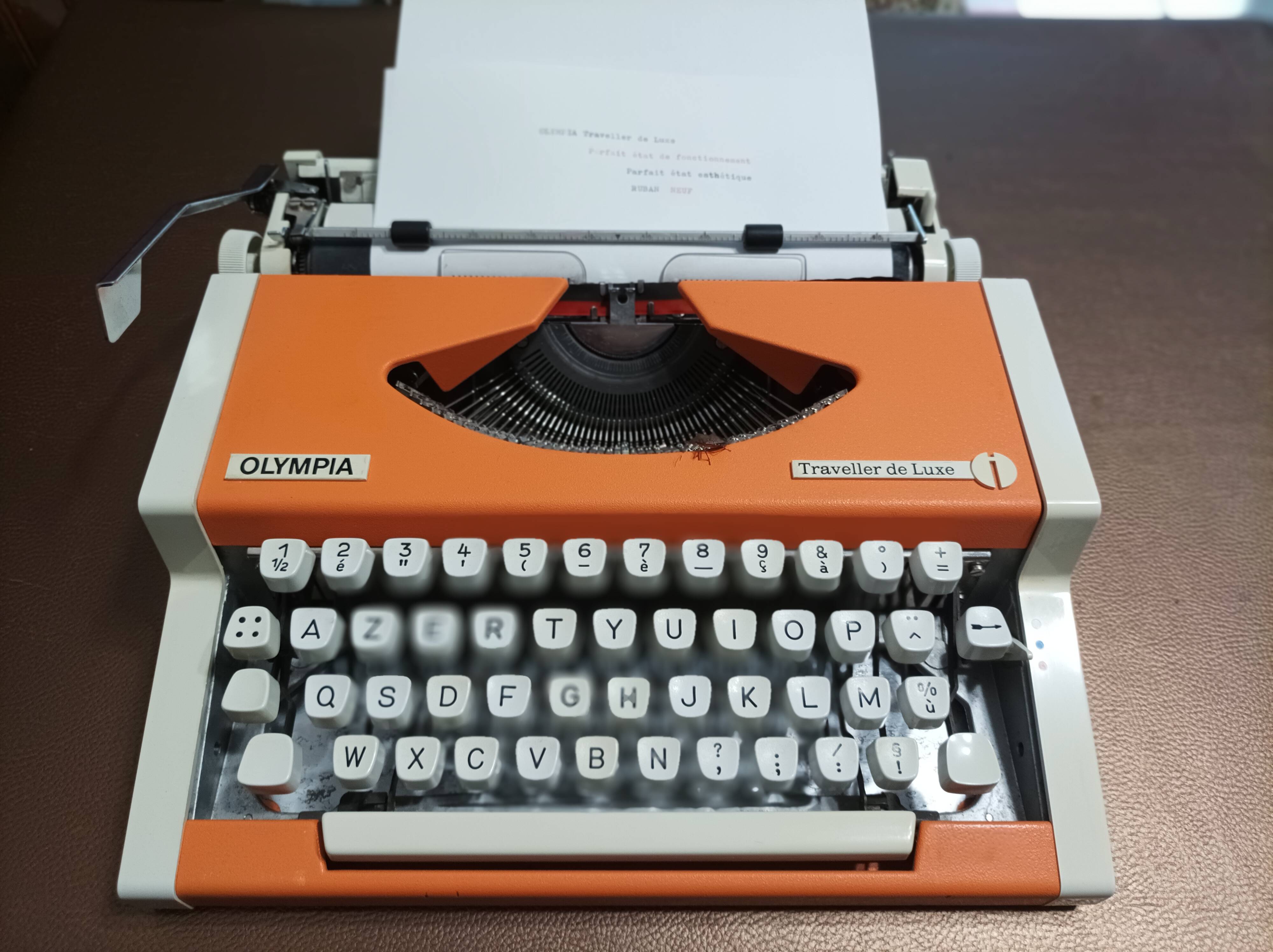 Olympia traveler de luxe orange typewriter serviced and new ribbon