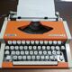 Olympia traveler de luxe orange typewriter serviced and new ribbon