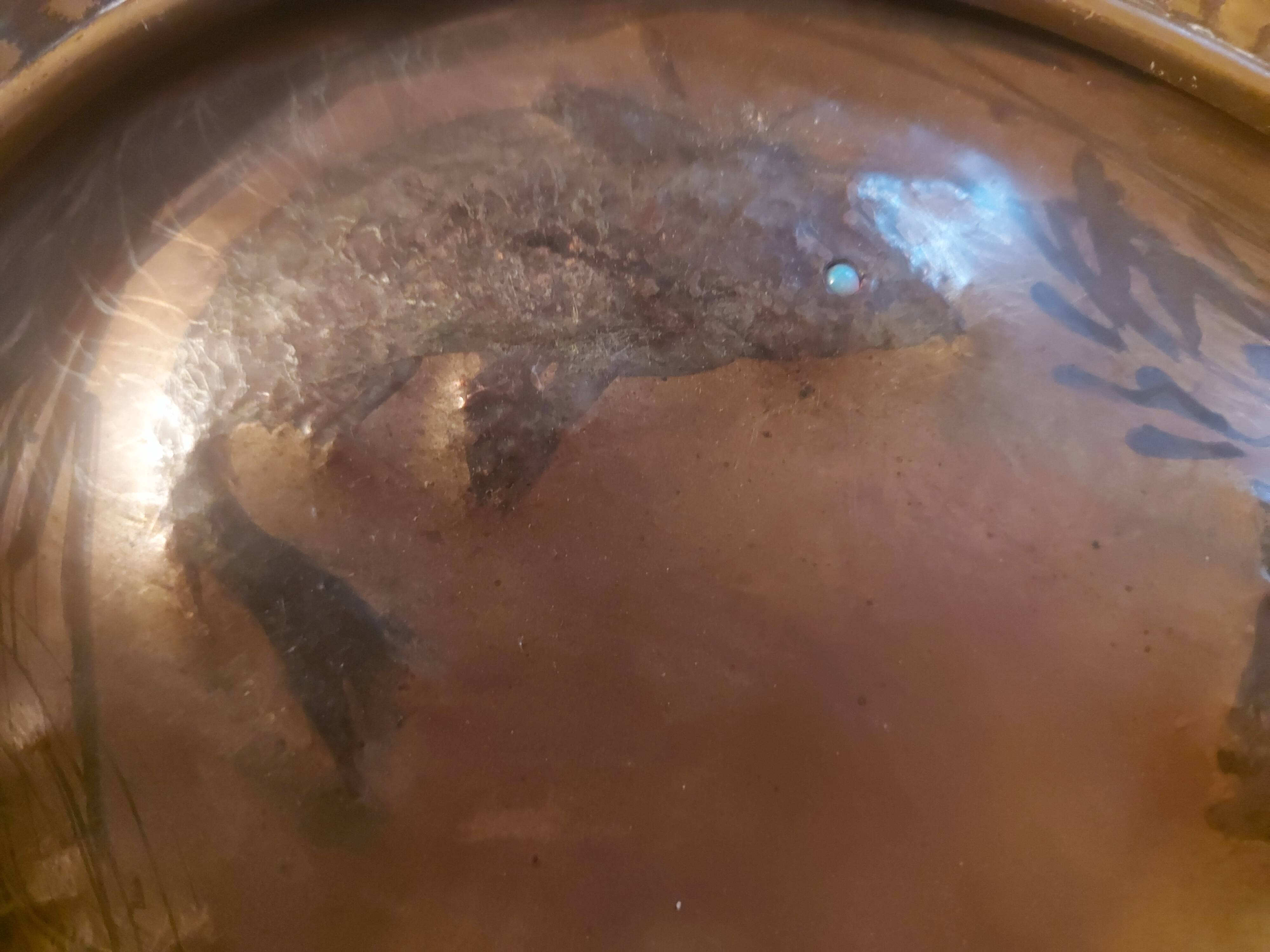 Decorative copper repoussé plate with marine motifs