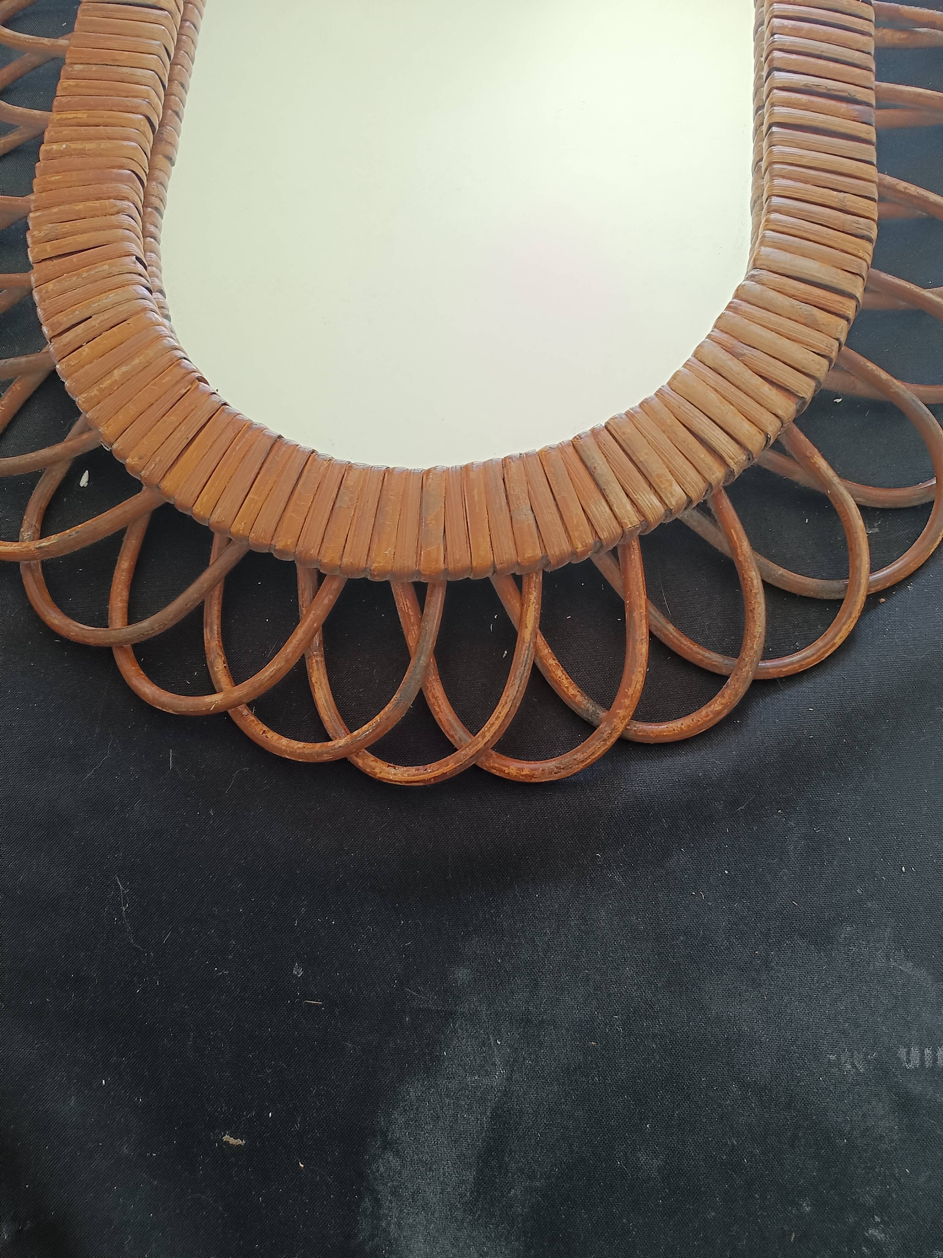 Large oval mirror from the 60s in rattan.